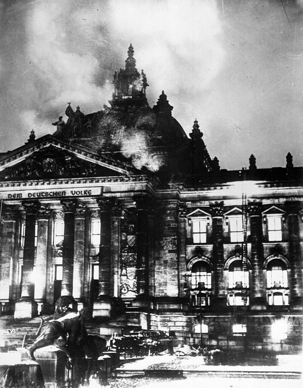 Black and white image of the German Reichstag (parliament) building on fire on February 27, 1933.