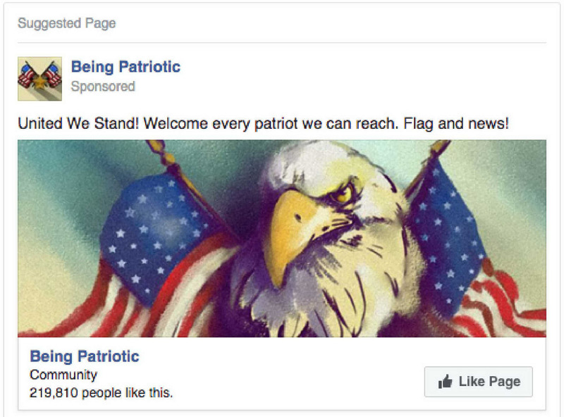 A screenshot of a Facebook ad sponsored by “Being Patriotic.” The ad copy reads, “United We Stand! Welcome every patriot we can reach. Flag and news!” The image features the head of a bald eagle between two American flags. The ad features a “Like Page” button and indicates that 219, 810 “people like this.”
